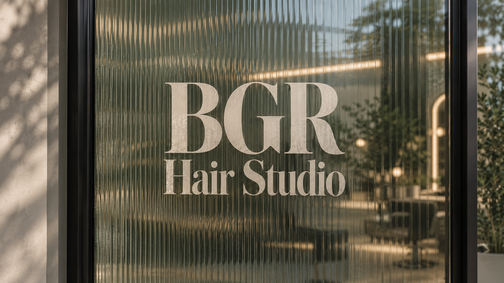 A BGR Hair Studios professional working with a client